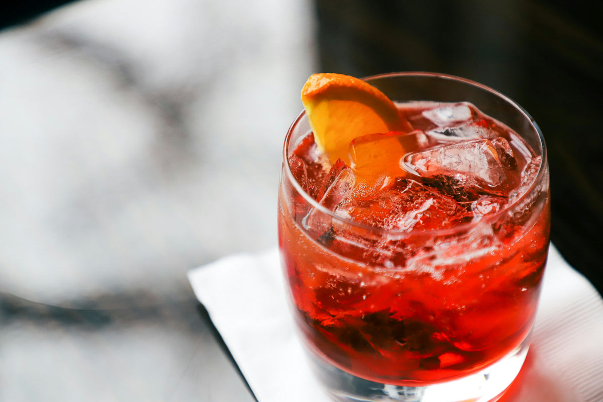 A bittersweet aperitivo served long over ice with a slice of orange